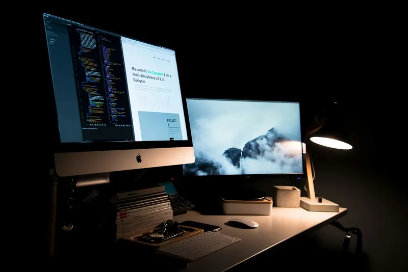 A laptop and notebook on a desk, ready for a pre-launch review